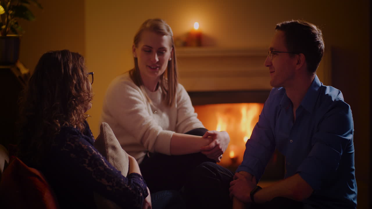 Friends Gather Around Fireplace