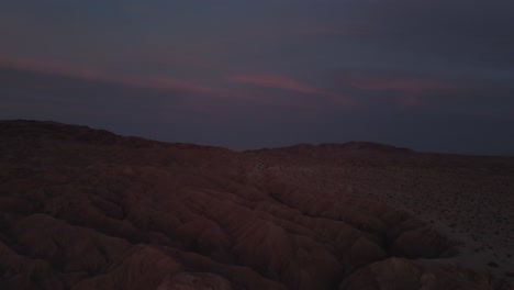 Aerial-footage-of-slot-canyon-descent-during-twilight