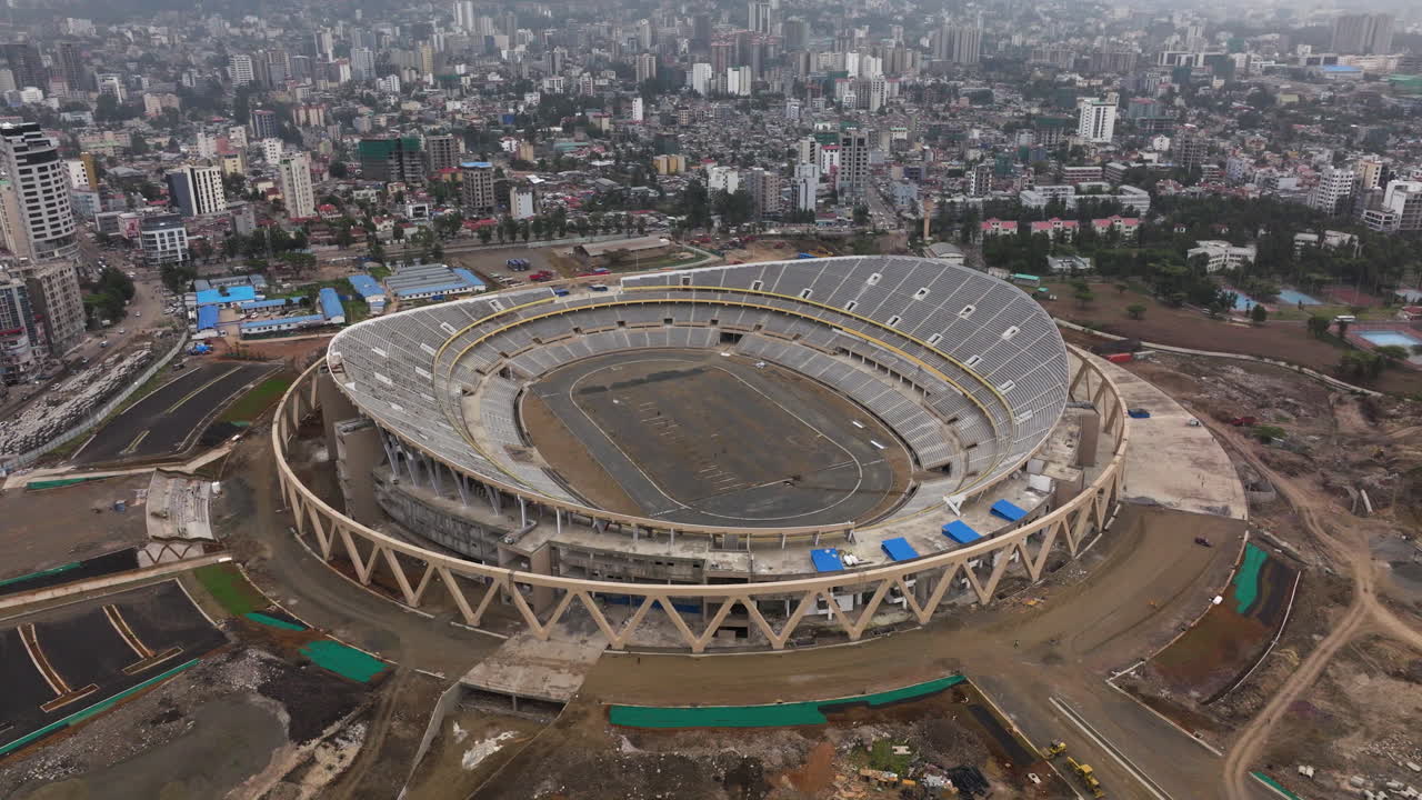 Adey Ababa Stadium With Cityscape In The Background In Bole, Ethiopia. - aerial shot