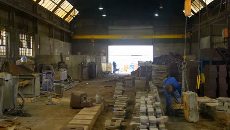 worker operating crane in foundry workshop 4k