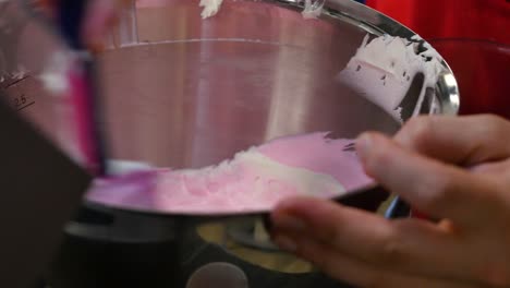 pink whipped cream in a stand mixer