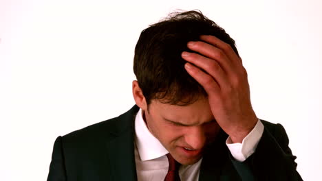 Businessman-with-headache-touching-his-head