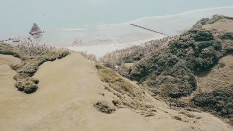 cinematic aerial drone video of a lighthouse perfect for travel and wedding films. the landmark is the tayid lighthouse located in basco batanes in the philippines.