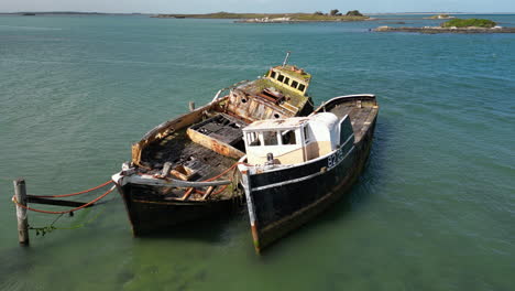 Ship-wreckage-closeup-in-Greenpoint-Ship-Graveyard,-Bluff-area,-New-Zealand,-aerial