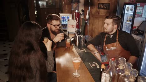 people enjoying drinks at a bar