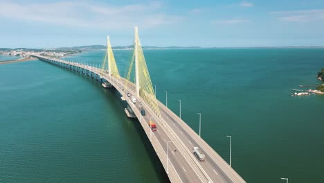 aerial view of trucks on bridge above the beautiful tropical ocean