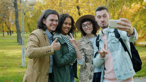 friends taking a selfie in an autumn park