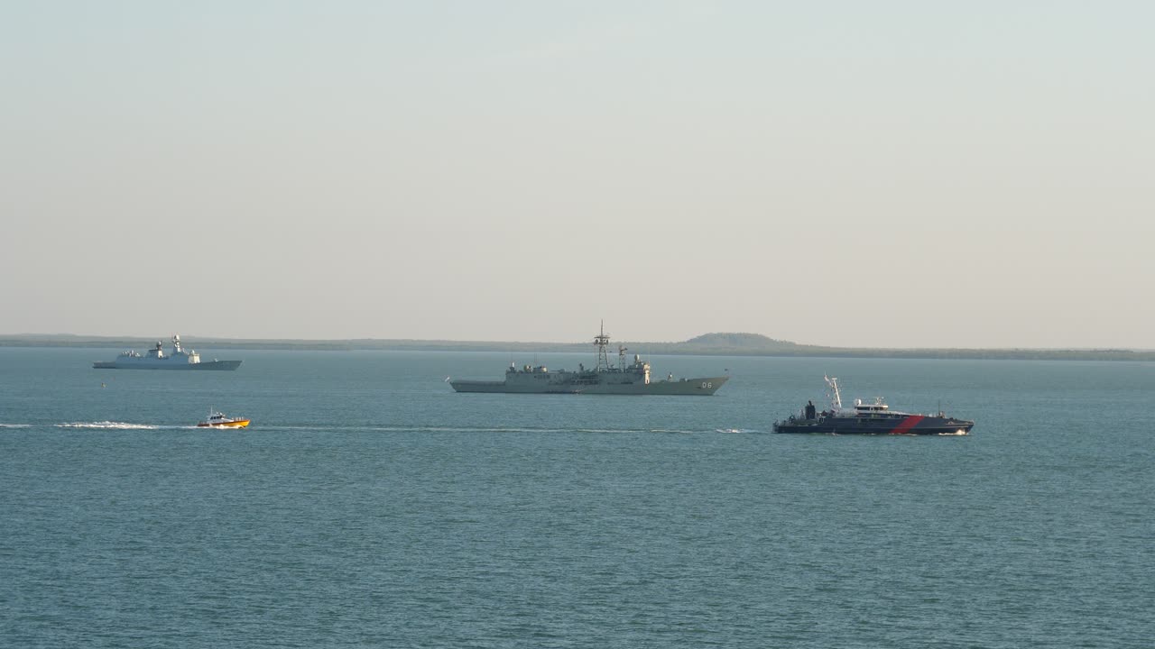 Australian Border Force Cape Class Patrol Boat passes HMAS Newcastle and INS Trishul