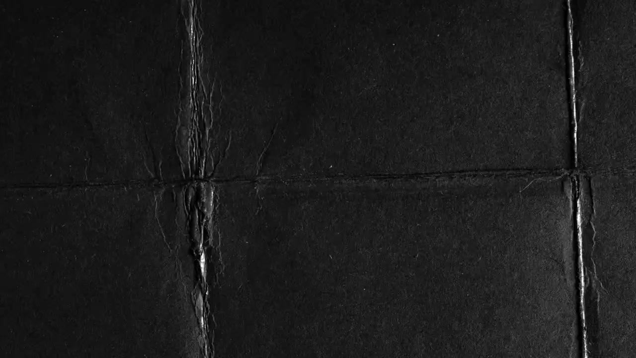 Abstract Black Crumpled Paper Texture Rotating Loop