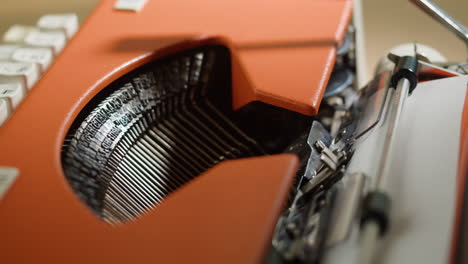 close-up of an orange vintage typewriter