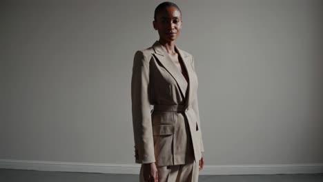 confident woman in beige business suit