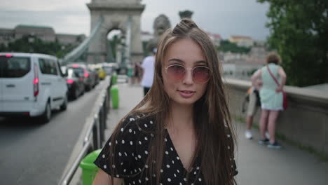 smiling woman on a bridge in budapest