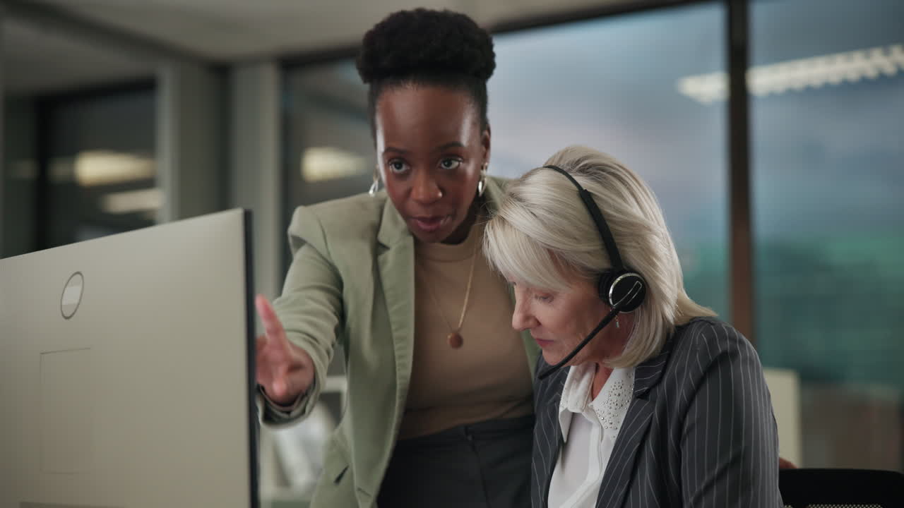 Business office workers with computer and headset