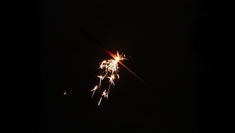 a sequence of sparkler bursts against a dark background