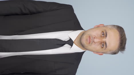 Vertical-video-of-Businessman-saying-stop-to-camera.