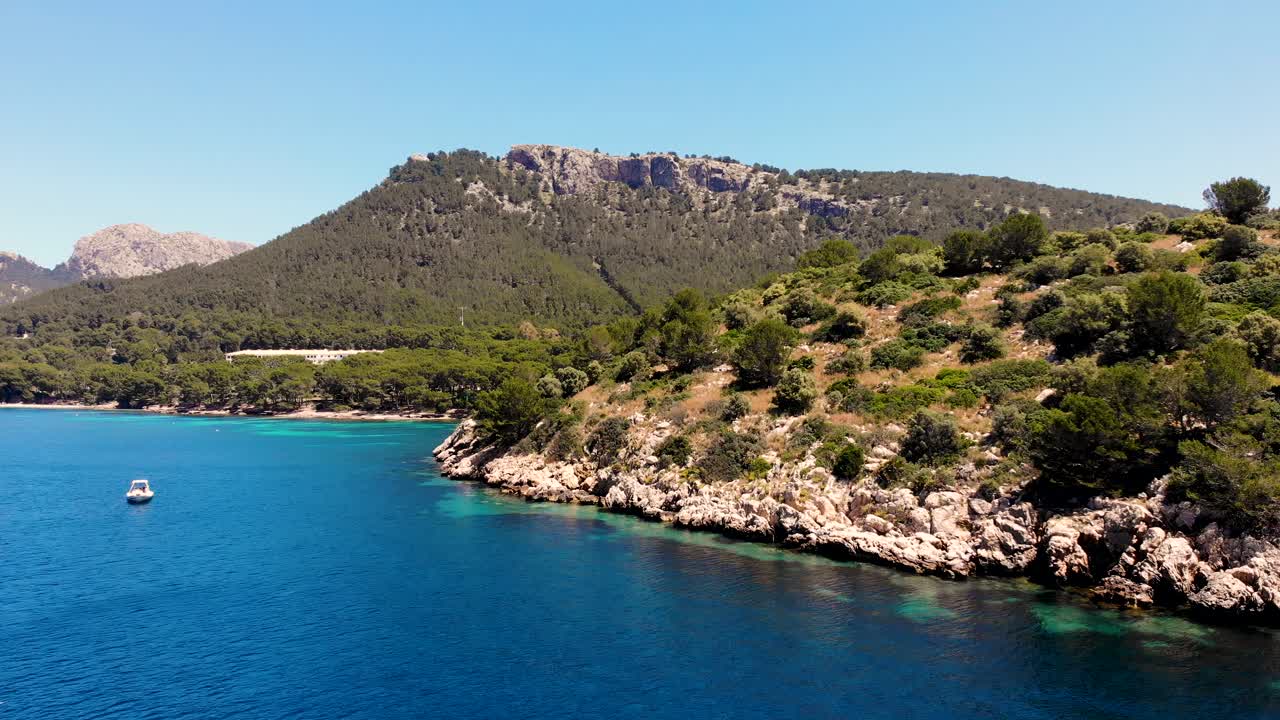 Leisure boat in idyllic clear Balearic waters with stunning scenery
