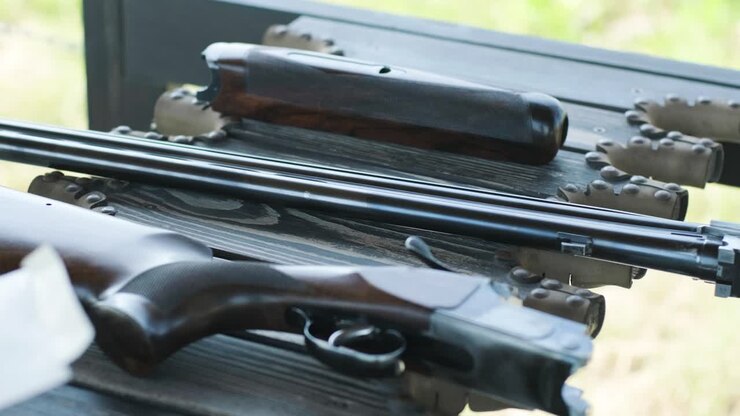 Hunting rifle and bullets. Shotgun. Close-up. Sport shooting from a gun in a shooting range.