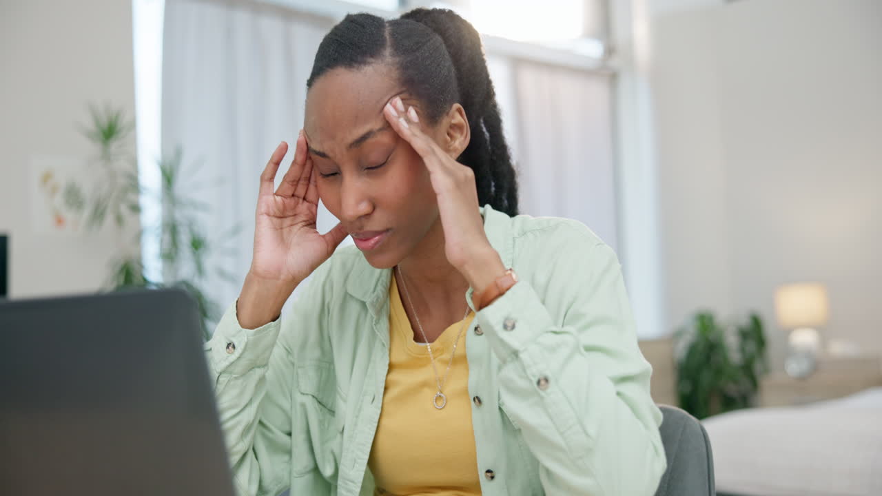 Laptop, headache and remote work of a black woman