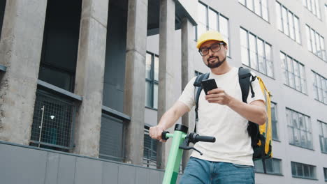 delivery person with electric scooter in urban setting