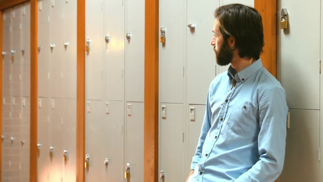 Student leaning against the lockers