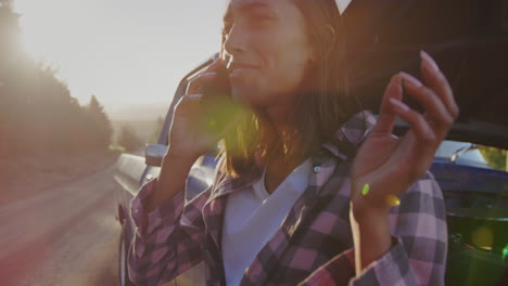 young woman on a road trip in pick-up truck