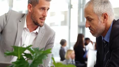 businessman interacting with colleague