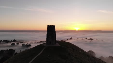 landscape aerial of the magical glastonbury tor at sunrise in somerset