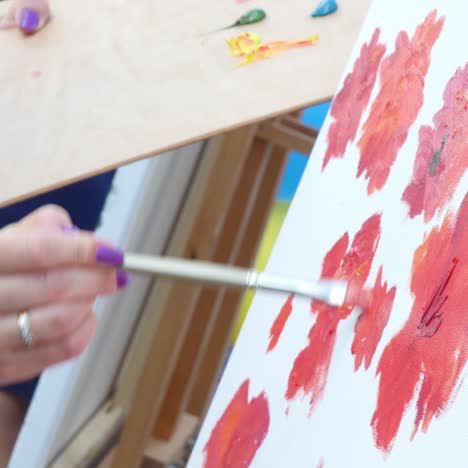 hand holding a paintbrush