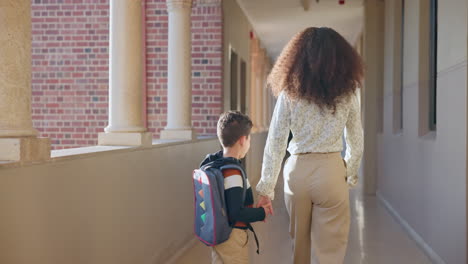 school, child and mother holding hands walking to