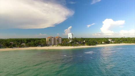 Miami-beach-with-clear-blue-water-and-fluffy-clouds-in-the-sky,-sunny-day,-aerial-view,-in-America