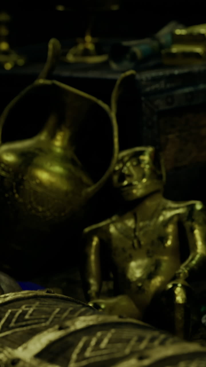 Exploring ancient treasures in a dimly lit cavern filled with artifacts