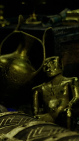exploring ancient treasures in a dimly lit cavern filled with artifacts