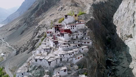 ancient buddhist monastery on a beautiful and remote, rocky mountain landscape