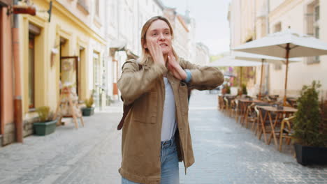 scared young woman worrying to be punctual with anxiety checking time on watch running late to work