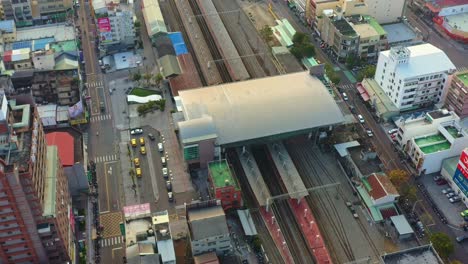 Aerial-views-capturing-military-vehicles-and-supplies-transported-by-rail,-passing-through-Douliu-station,-Yunlin-county,-countryside-of-Taiwan