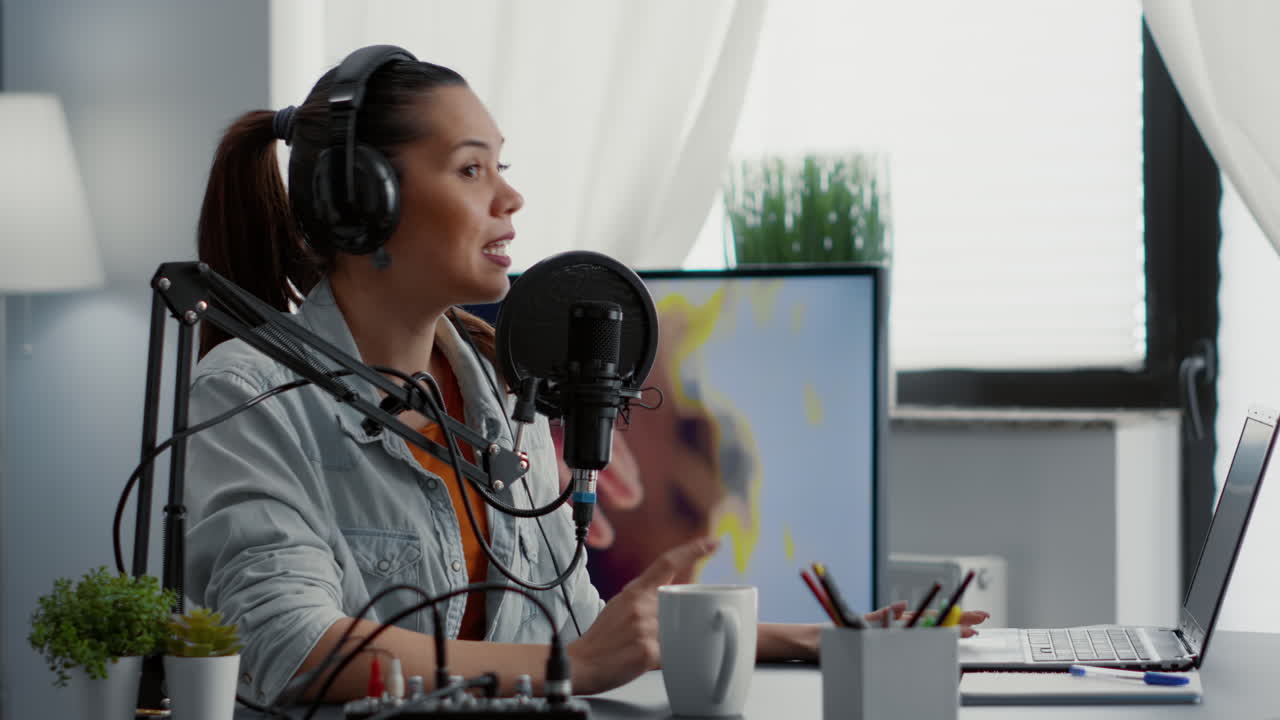Creative internet influencer putting headphones on while recording video blog