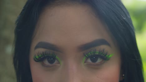 amazing close up of a woman eyes with green highlight makeup