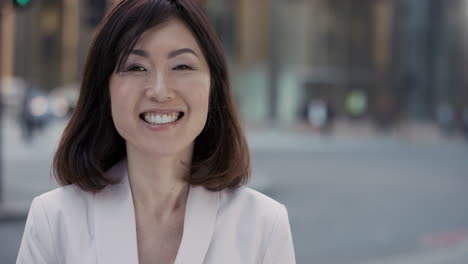 slow motion portrait of beautiful japanese businesswoman smiling