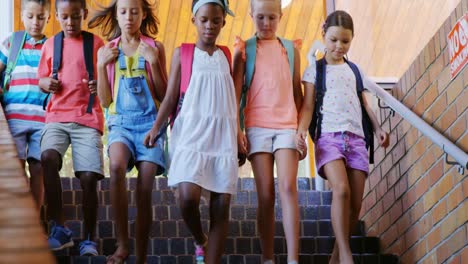 Group-of-kids-getting-down-from-staircase