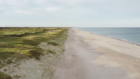 a peaceful scene featuring an unobstructed vista of the shoreline - drone flying forward