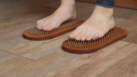 feet on nail mats for reflexology