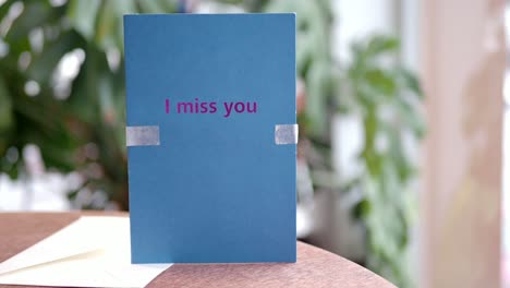 greeting card with "i miss you" message