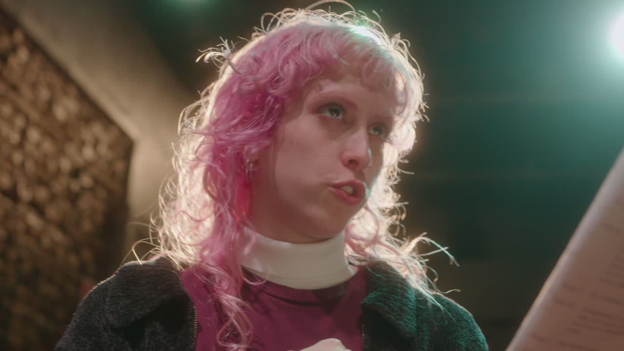 Actress Reading Play Script and Talking on Stage during Rehearsal