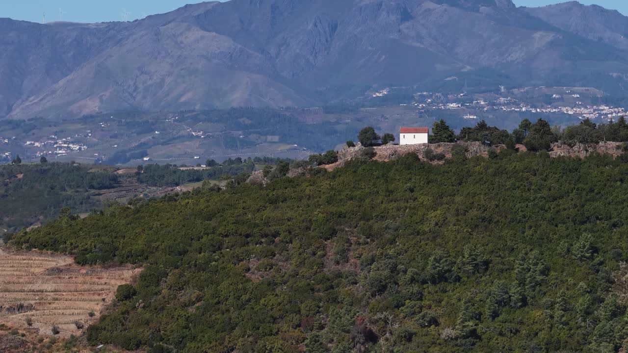 Douro Valley chapel and big mountain range reveal on a sunny day