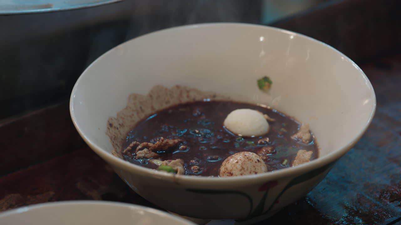 Thai Noodle Soup Being Served