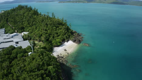 drone shot of a tropical white sandy beach with turquoise water