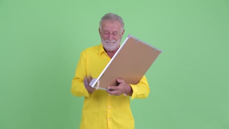 funny handsome senior bearded businessman