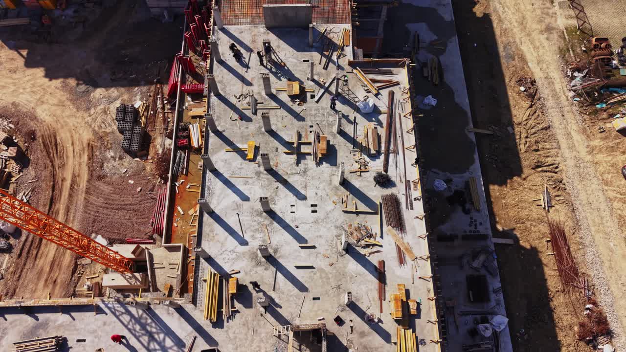 Aerial View of a Building Construction Site with Crane