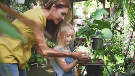 mother and daughter passing time together in  in a botanical garden