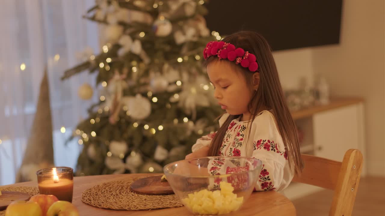 Mother and Daughter Preparing for Christmas Celebration
